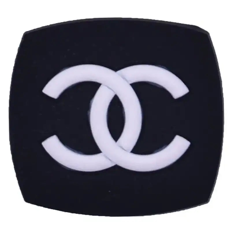 CC stylized white on black shaped badge 23-57 Shoe Charm