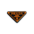 Prada triplate stylised badge logo orange on black MQ087-60 Shoe Charm