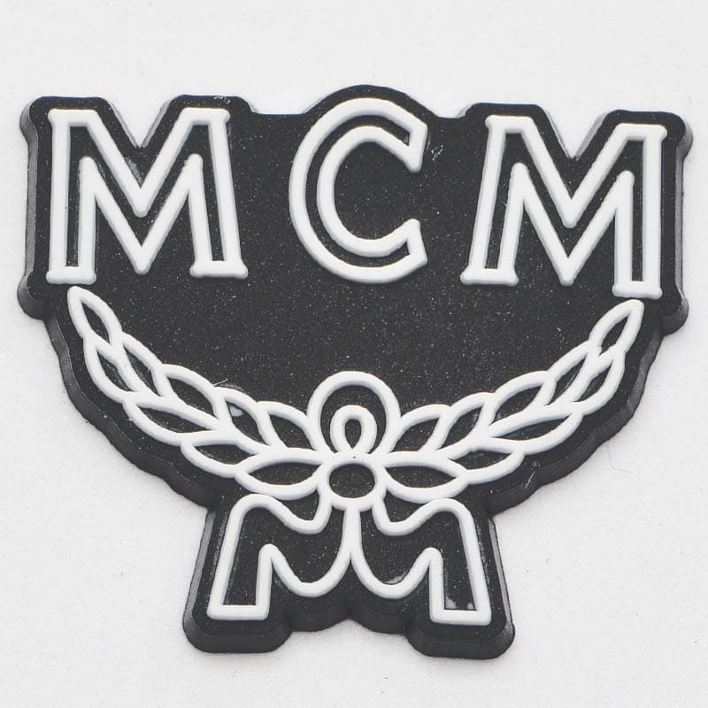 MCM Stylised shield white on black P2236 Shoe Charm