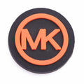 MK Round Badge orange P4132 Shoe Charm